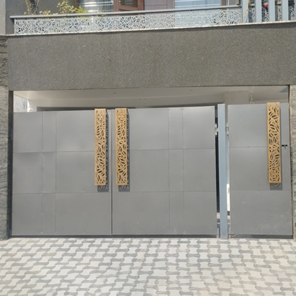 Modern grey gate with wooden decorative panels by Nirmaan Groups